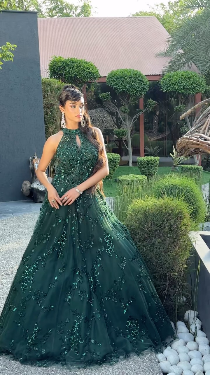 ✨ Draped in emerald elegance, where every shimmer tells a story. This statement gown is made for unforgettable entrances., Discover your dream occasion look with Peacock Attire ✨ Shop the collection 