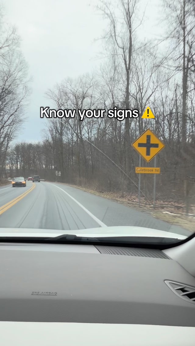 Yellow sign with a is a caution that there is an intersection up ahead ...