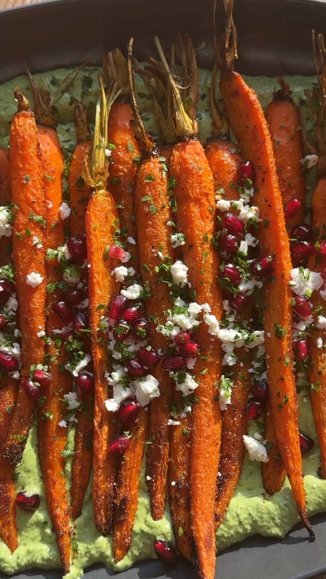 roasted carrots green goddess dressing over Feta Sauce make for a delicious holiday side dish! | Crowded Kitchen flowing