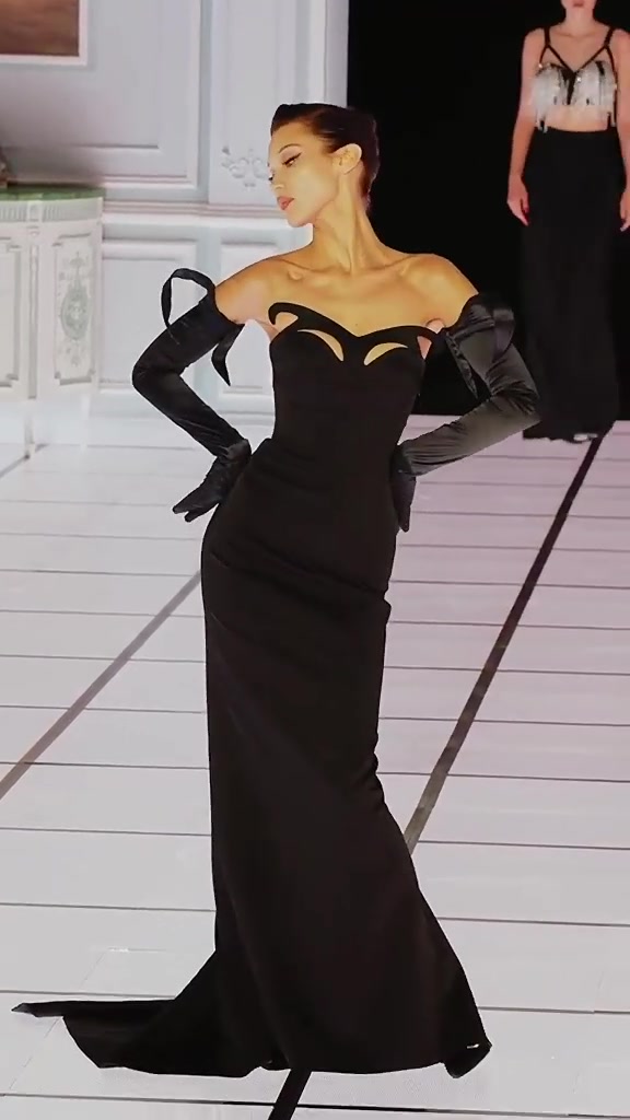 bella hadid black dress runway in blue: Bella steps onto the in a fluid jersey and tie-detail pumps from the new #BOSSFW20 collection #MFW Discover more: bit.ly/-BOSSFW20 Color:Cornflower