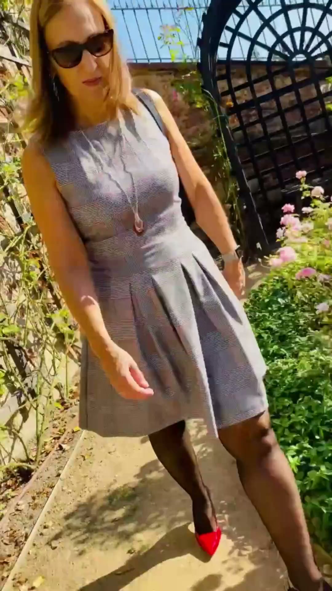 grey dress red heels make quiet confidence impossible to miss., Tailored checks, garden light, and a beautifully fearless mood., Bold or classic — which wins?, #LadyCharm #ClassicFemininity | Lady Charm what color shoes to wear with a grey bridesmaid dress