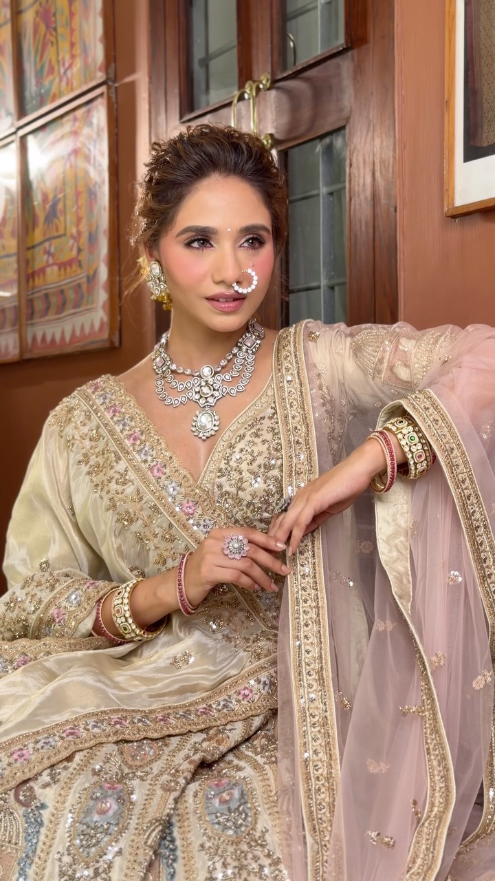 ivory indian wedding dresses Modern day brides shine effortlessly in with graceful style ✨, [ bridal look, modern hairstyle, hairstyle inspiration, makeup india, modern bride, modern makeup, close bun hairstyle, bridal Pen Slot
