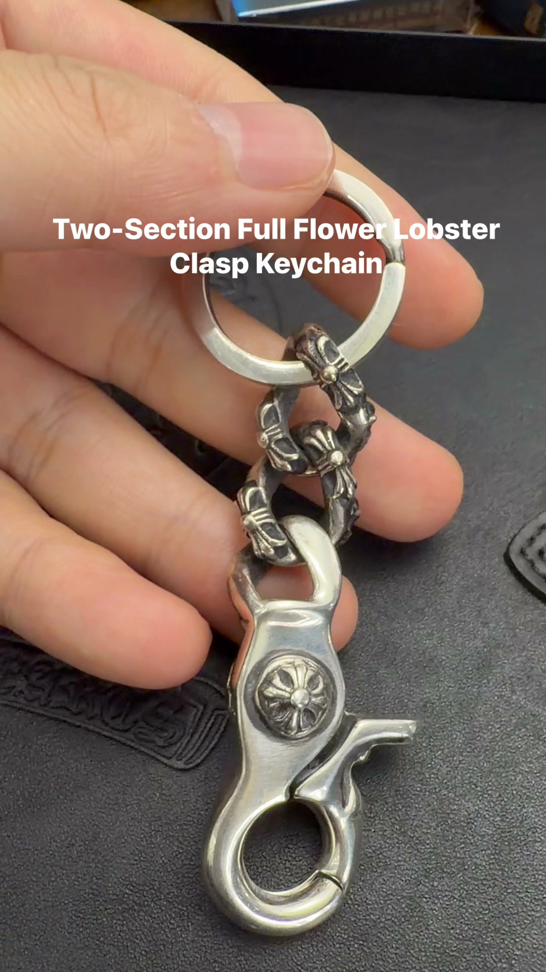 Features detailed cross‑flower engraving on lobster snap and chain