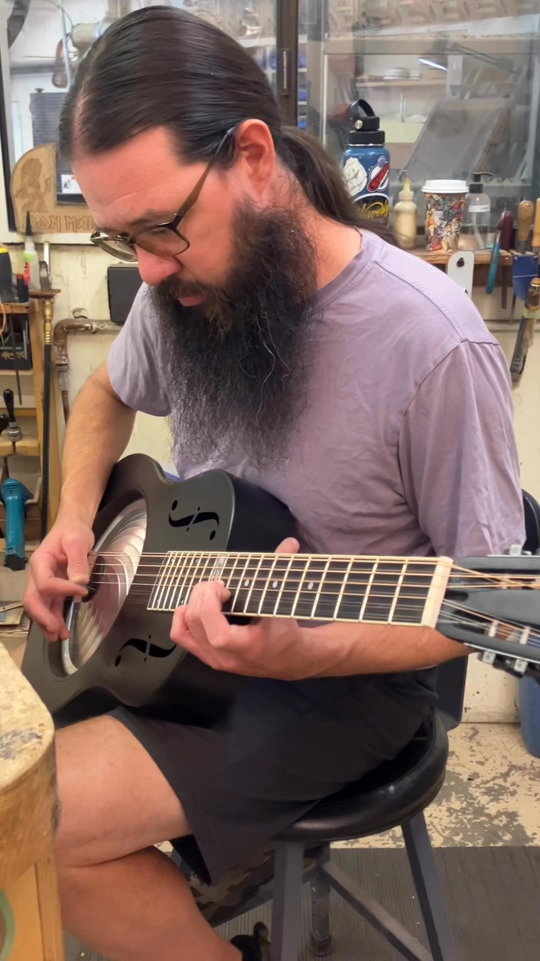 This is a 2005 National Delphi resonator guitar in a slick blue