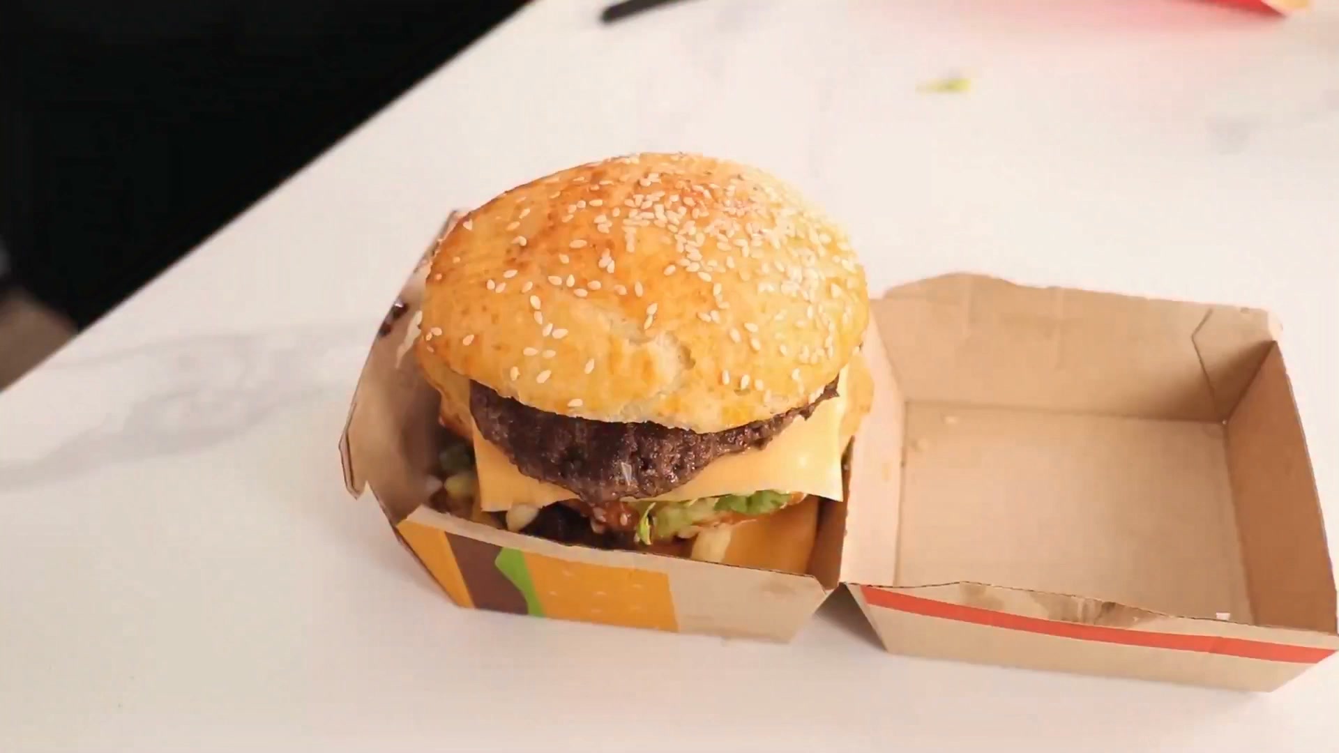 A Big Mac topped with gold flakes, driven to a McDonald's drive
