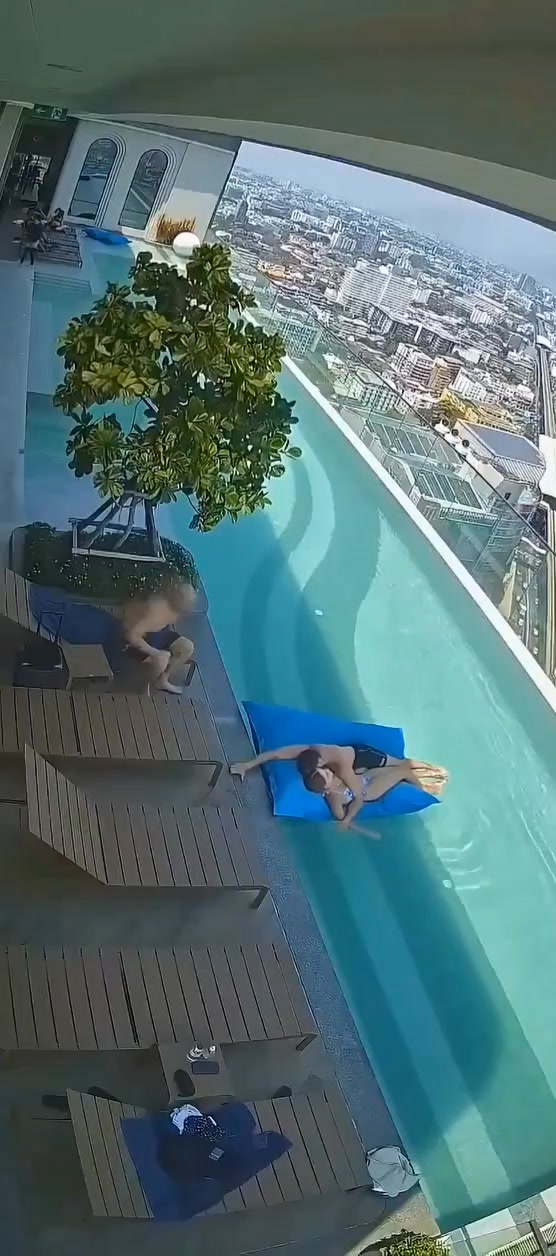 BANGKOK - CCTV footage from a swimming pool in a building in Bangkok ...