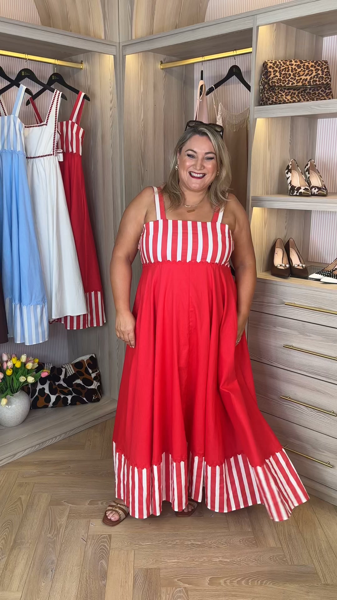Next up is our gorgeous red stripe midi summer dress. ❤️, The best part? It has pockets! 🙌 Available in two colours – red and blue – and two lengths: Regular and Petite, so you can find your perfect 