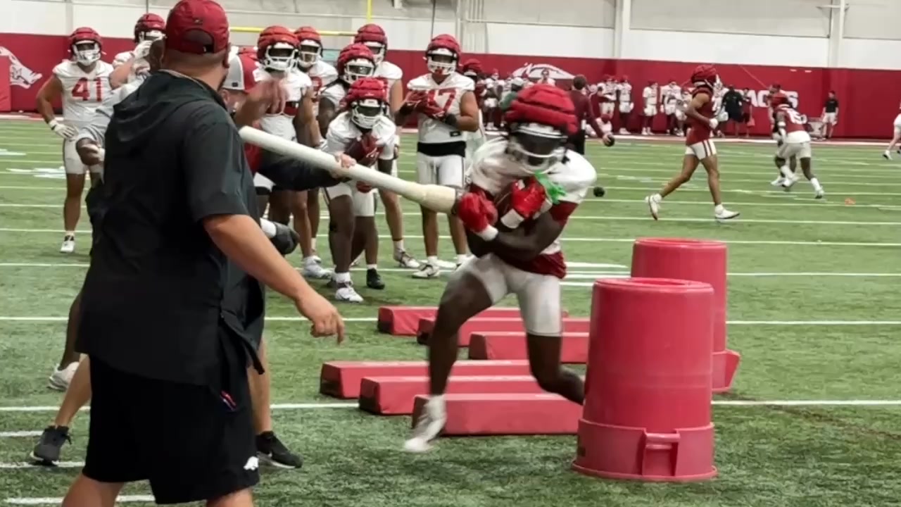 Arkansas running backs and tight ends go through ball security drills ...