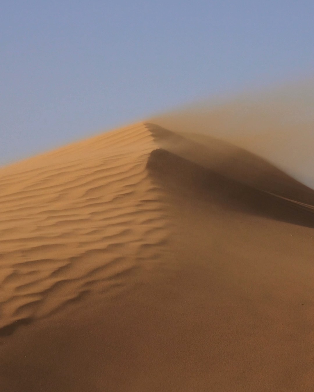 Listen to sand sing. (No really!) Go to the Gobi Desert in Asia or