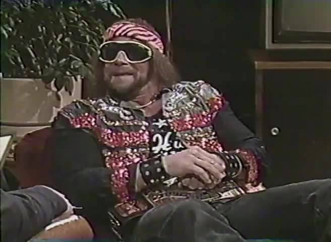 Macho Man” Randy Savage and Miss Elizabeth with a fan in