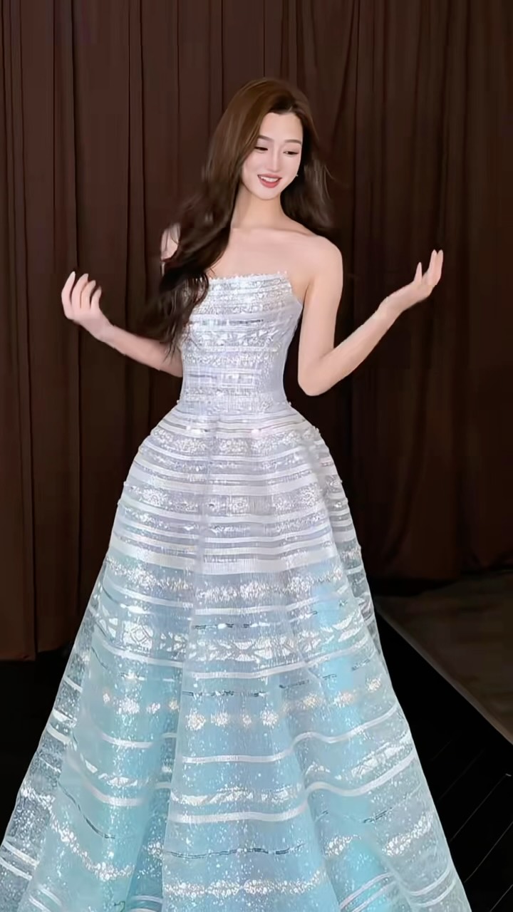 If Cinderella had a dress code… this would be it. 🩵✨, Icy blue, sculpted to perfection and covered in light-catching details. A statement ballgown made for grand entrances, gala nights and moments 