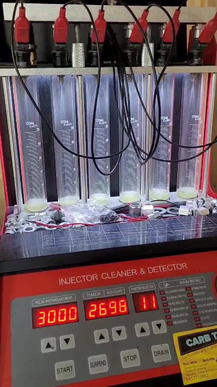 Testing a set of injectors out of a V6 Commodore after cleaning. | Paul ...