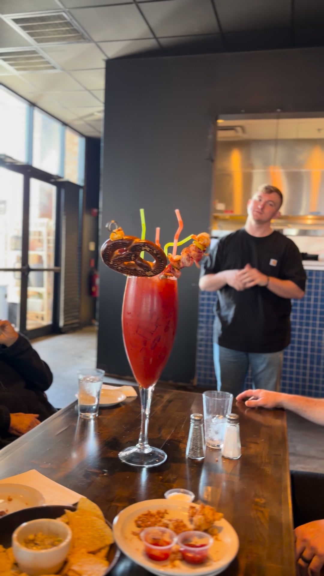 Mega Bloody Mary with a giant soft pretzel, shrimp, bacon, cheese