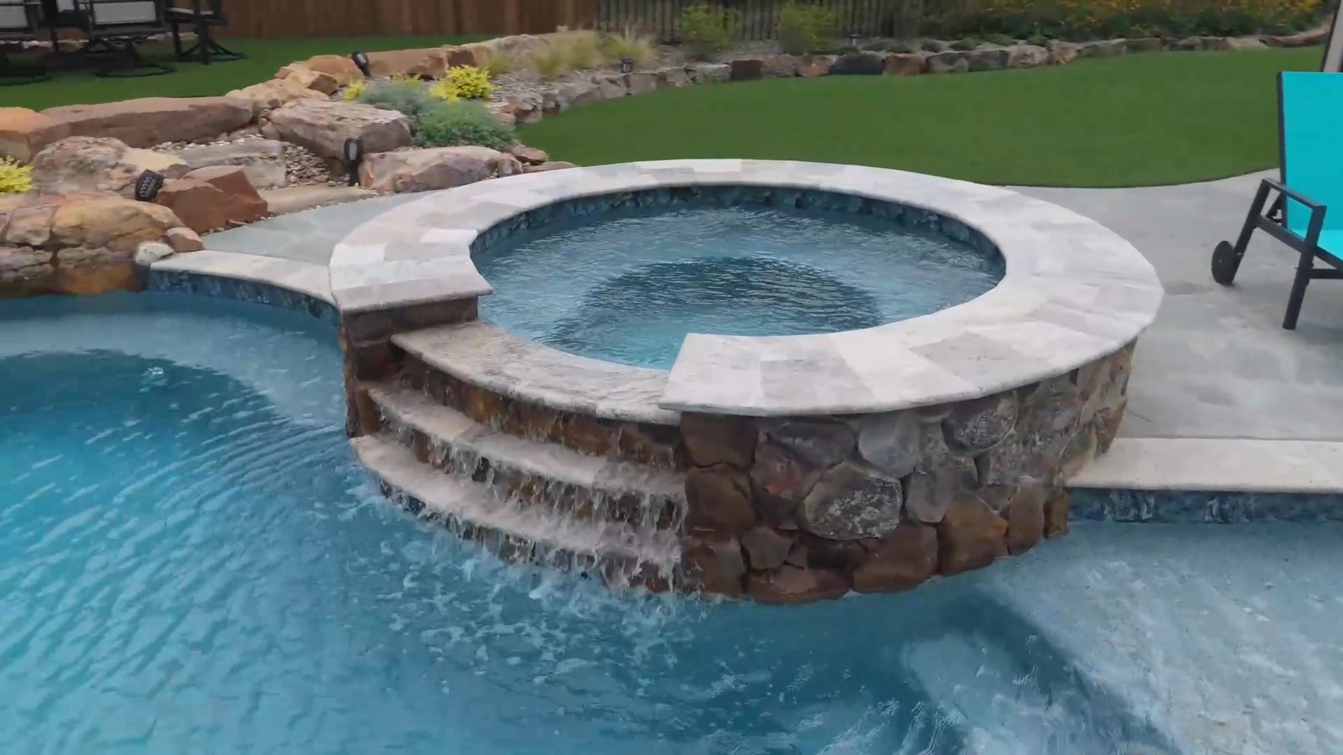 Experience the ultimate in relaxation with this exquisite freeform pool ...