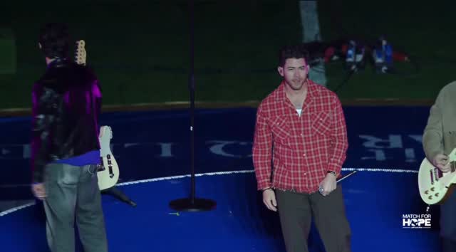 Jonas Brothers performing “Only Human” during the Match For Hope ...