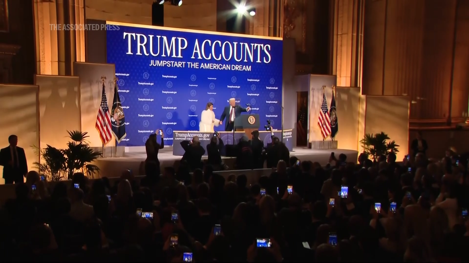 President Donald Trump celebrates the launch of a program the White ...