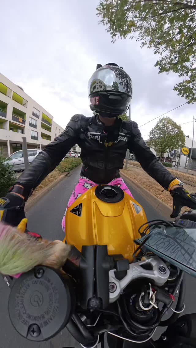 Pink skies, a matching helmet, and a custom Hello Kitty sportbike