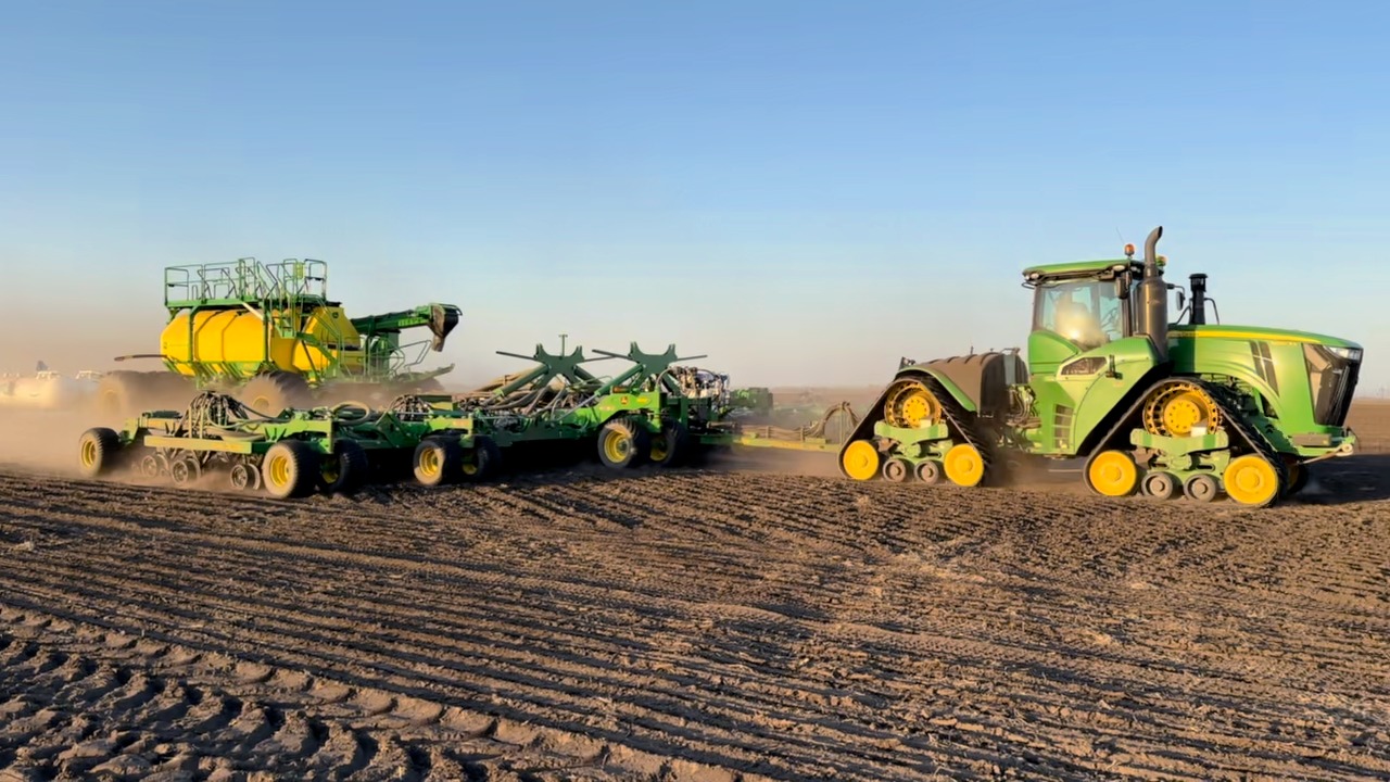 The John Deere N560F air drill with a C650T cart out in the field near ...