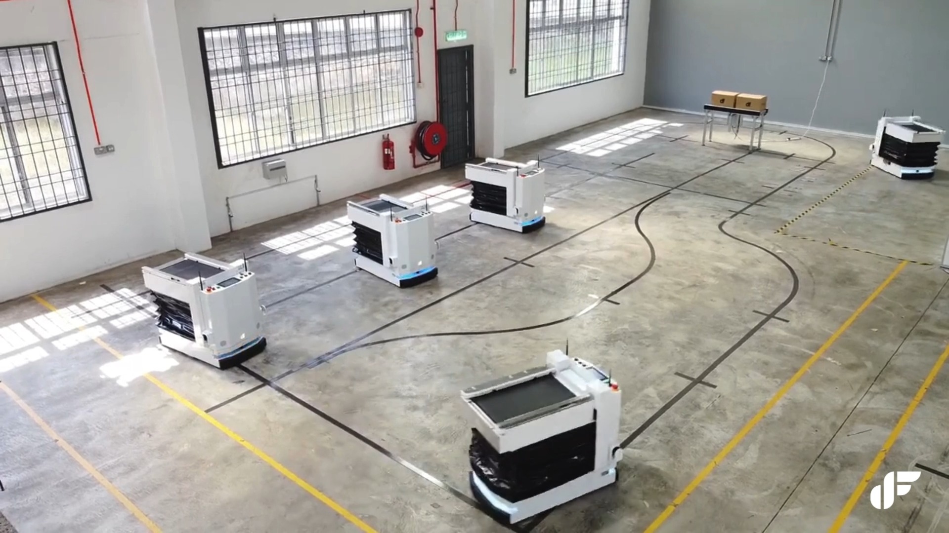 The Zalpha AMR, equipped with a conveyor lifter module capable of ...