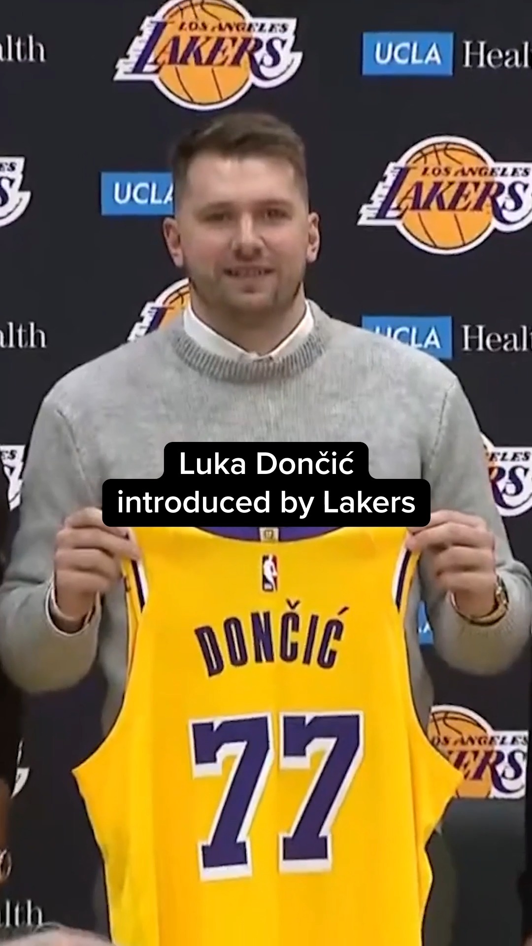 Luka Doncic held up his No. 77 Lakers jersey Tuesday at his first