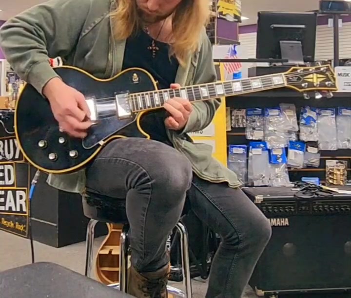 The amazing John Sykes with his black Les Paul Custom.