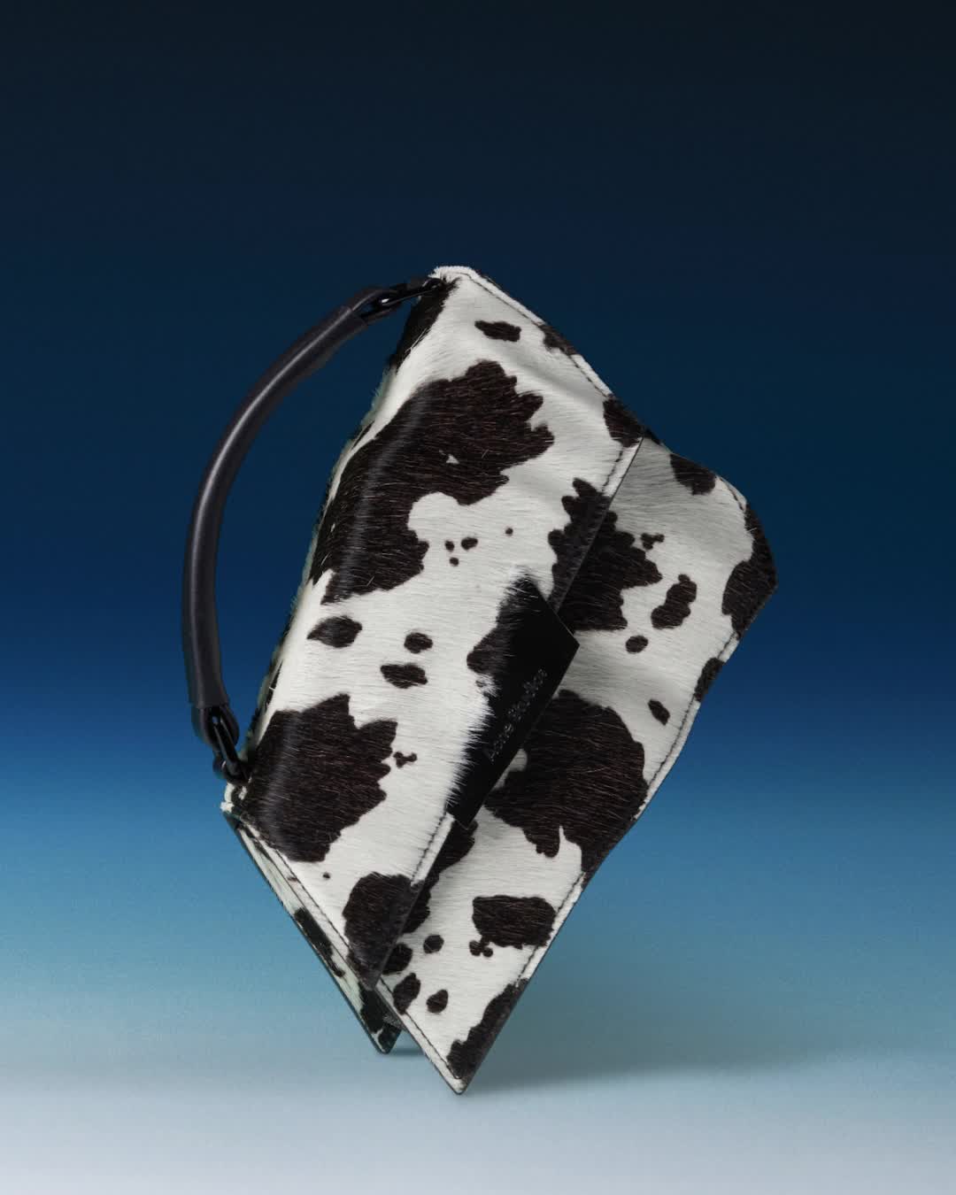 Bold new prints; a warped silhouette. The Distortion bag, captured