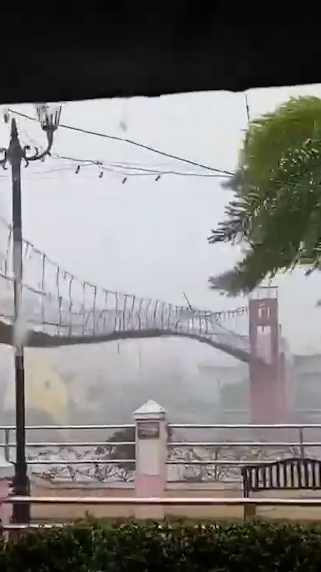 A pedestrian bridge was completely rattled when Super Typhoon Fung-wong ...