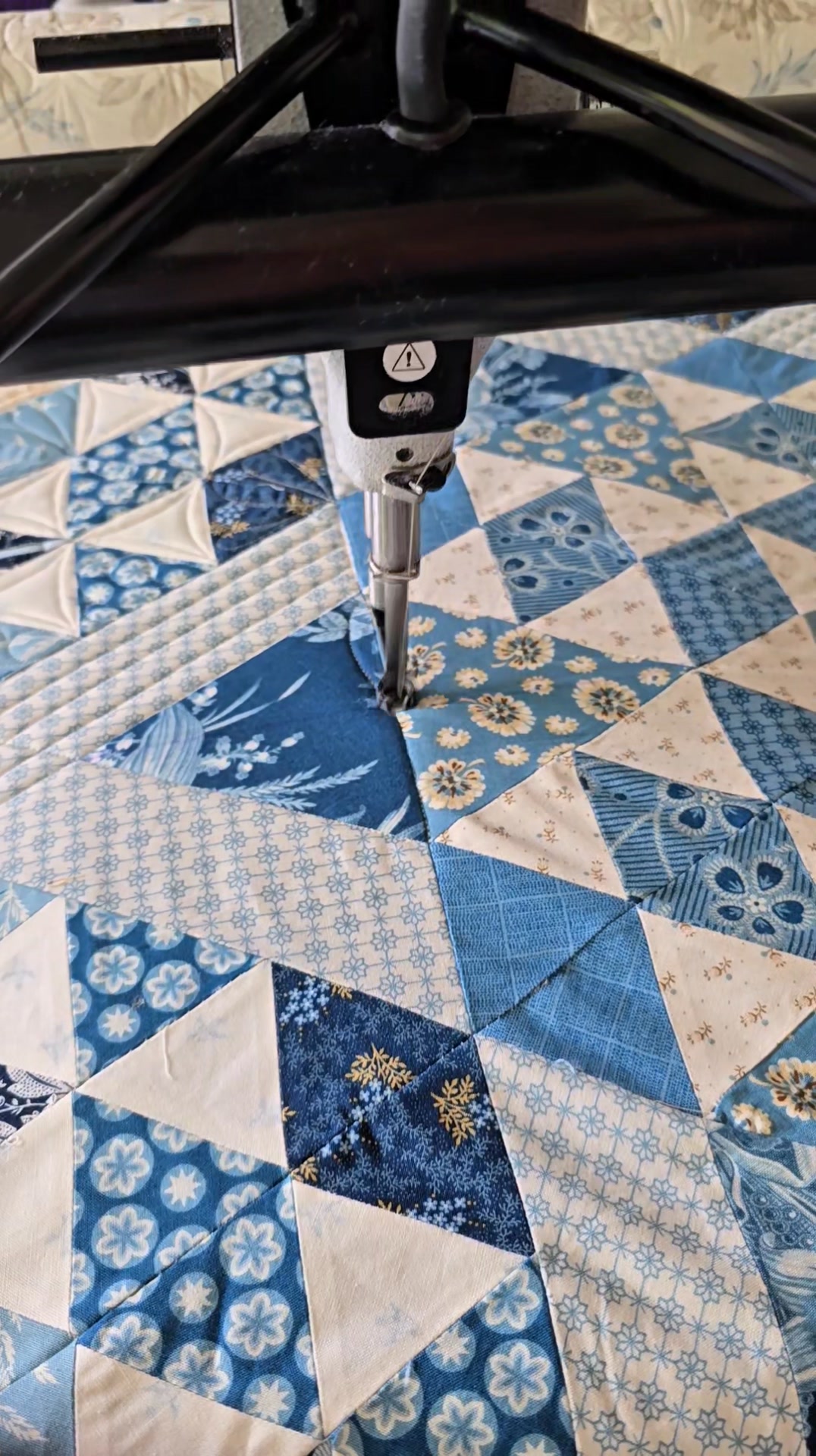 When I machine quilt feathers across two triangles—like I'm doing here ...