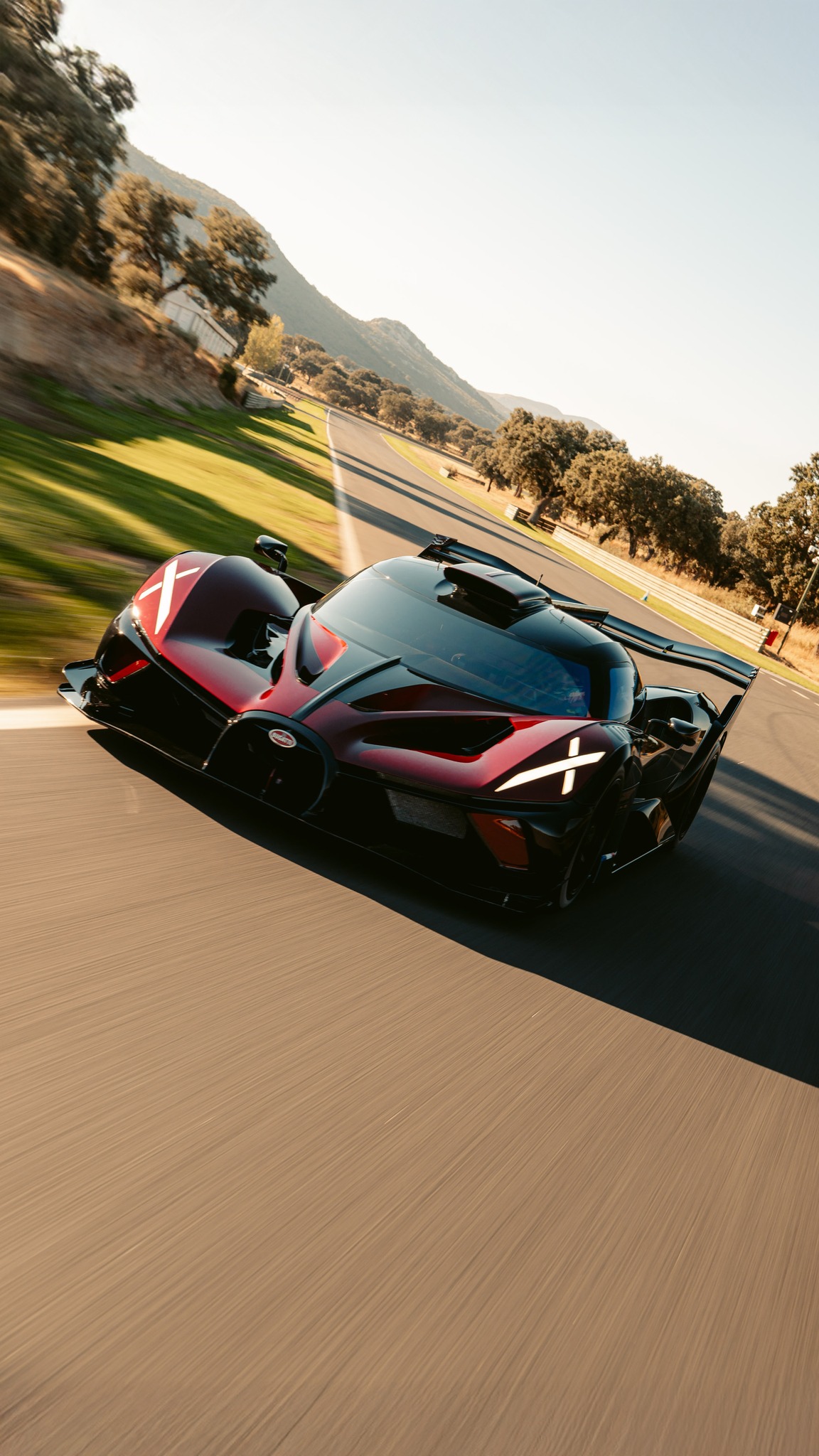 A rare sight: the BUGATTI BOLIDE taking on the sweeping corners of the Ascari Circuit., Crafted as an uncompromised vision of track performance, the BOLIDE’s ultra-lightweight carbon monocoque,