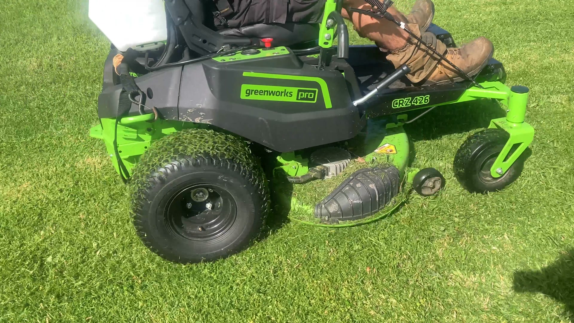 Greenworks mowing with the John Kavli Finisha Blade chute down