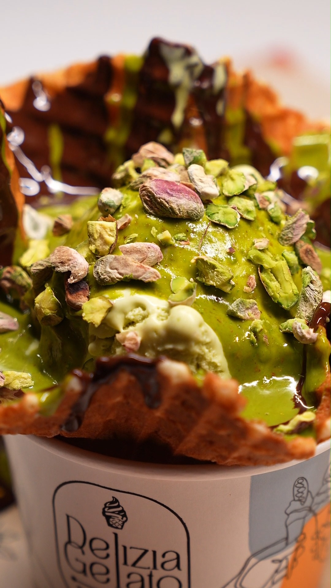 Dive into our Pistachio Cub Cone loaded with extra pistachio sauce and ...