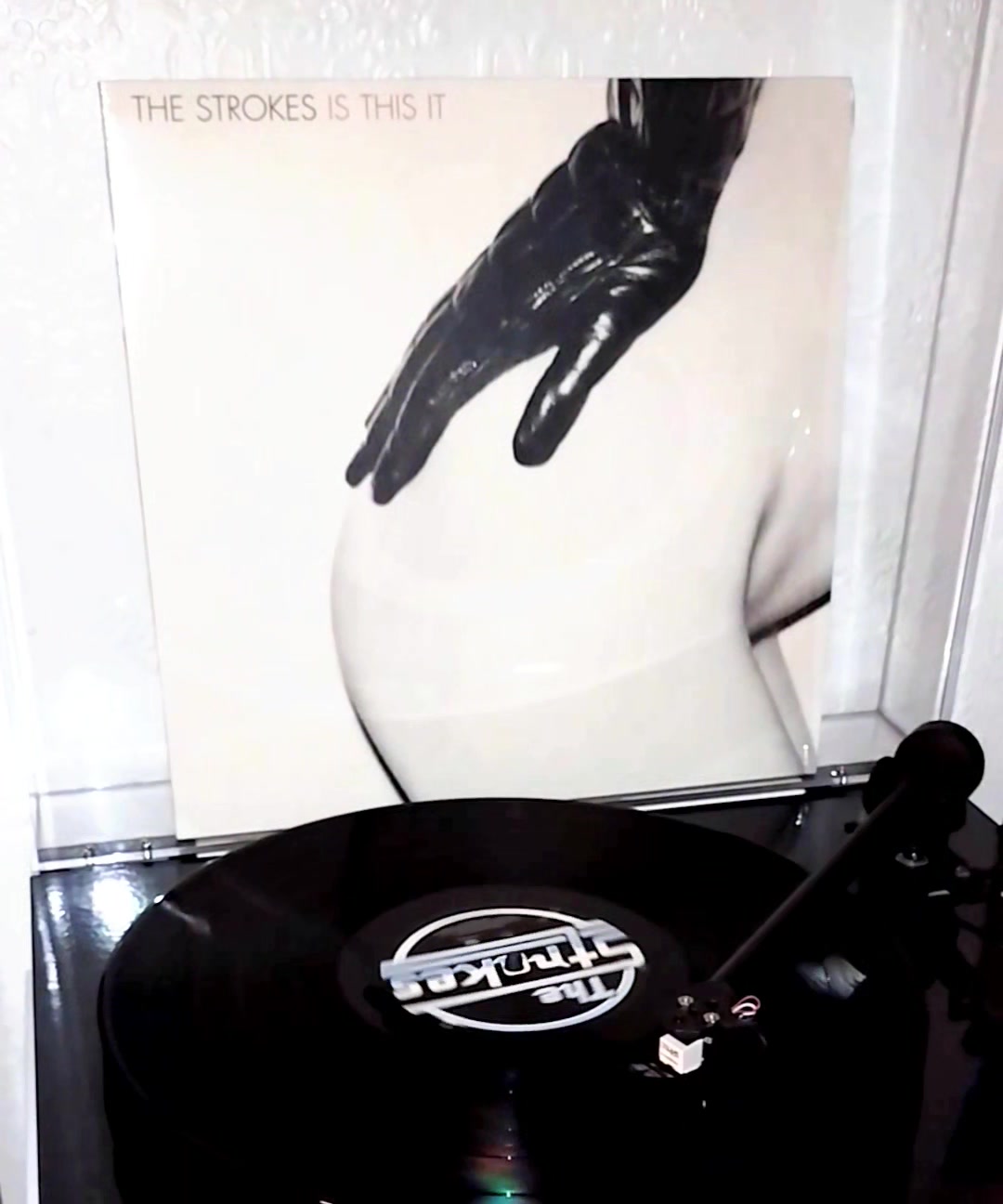 What is the original cover art of The Strokes' 'Is This It' album?