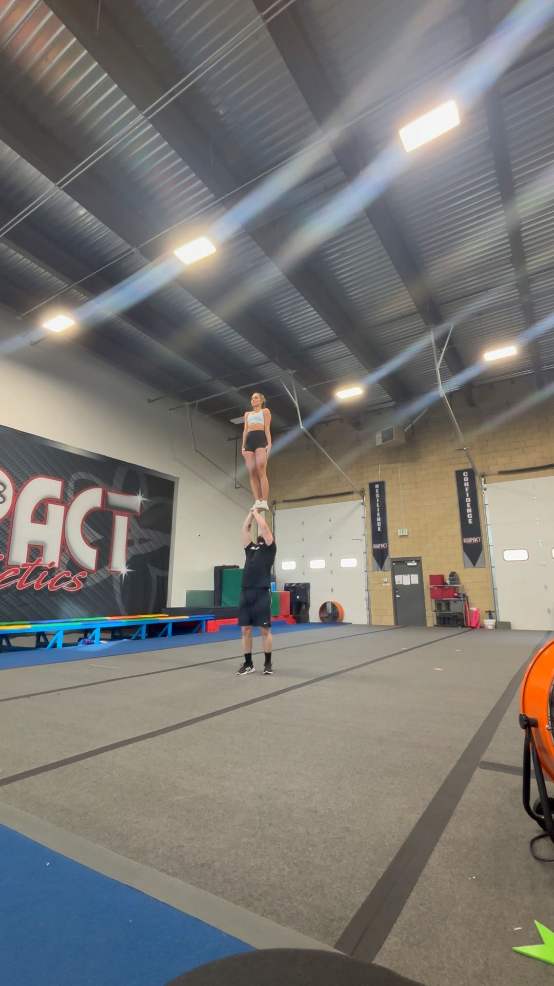 Kat and Michael performing their NCA Partner Stunt routine at a high ...
