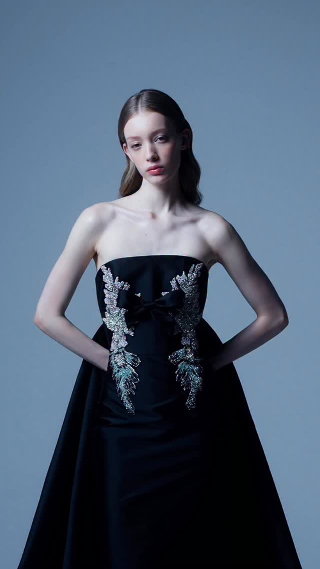 alba.baptista wears a white sage satin dress with a draped bodice, sculpted waist detailing, and a thigh-high slit from the ZUHAIR MURAD Ready-To-Wear Pre-Fall 2025 Collection to the 98th Annual Oscars. Styled
