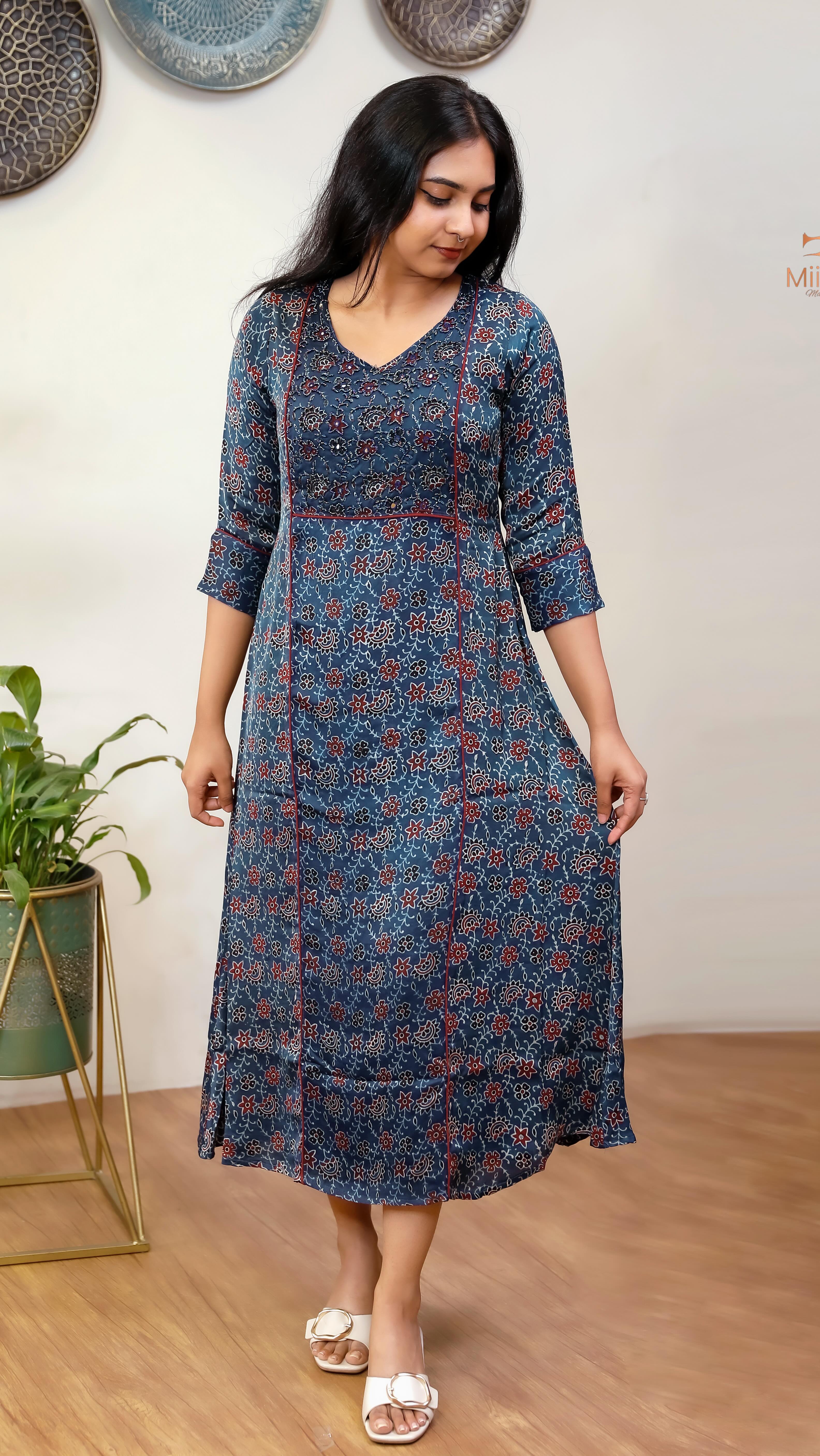 Pure modal silk dress kurti with lining, featuring a three-panel pattern with piping. The yoke is elegantly highlighted with sequins, sugar beads, cut beads, and mirrors. Crafted from premium fabric, 