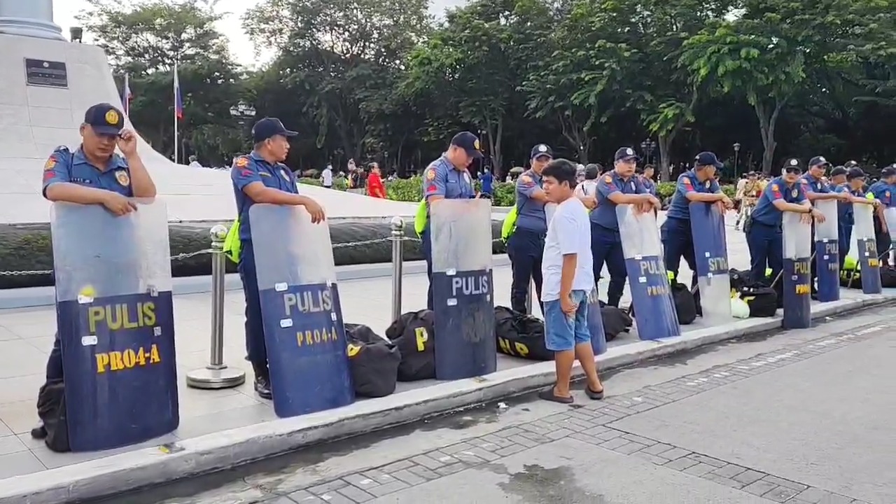 Members of the Philippine National Police (PNP) are in place as ...