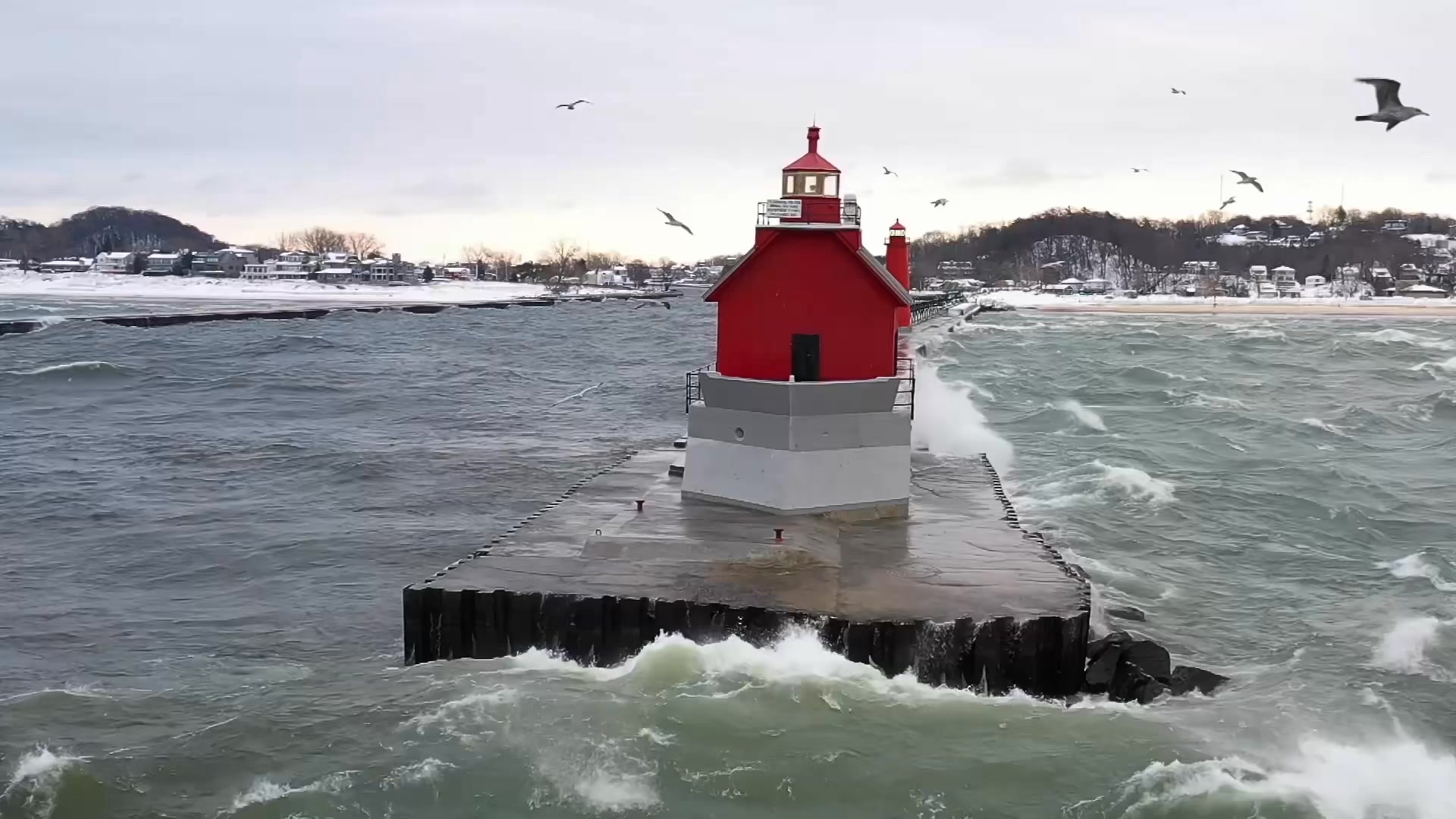 MASSIVE waves slam Grand Haven’s iconic lighthouse this evening 🌊 ...