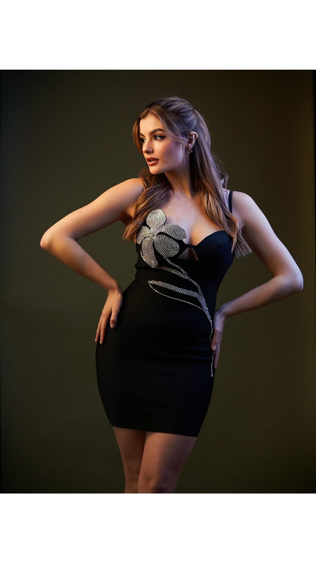 Bella Barnett's black-and-white off-shoulder gown is a masterclass in dramatic elegance. The flowing skirt and bold color blocking make it a standout for any glamorous event. , Thanks to @ 