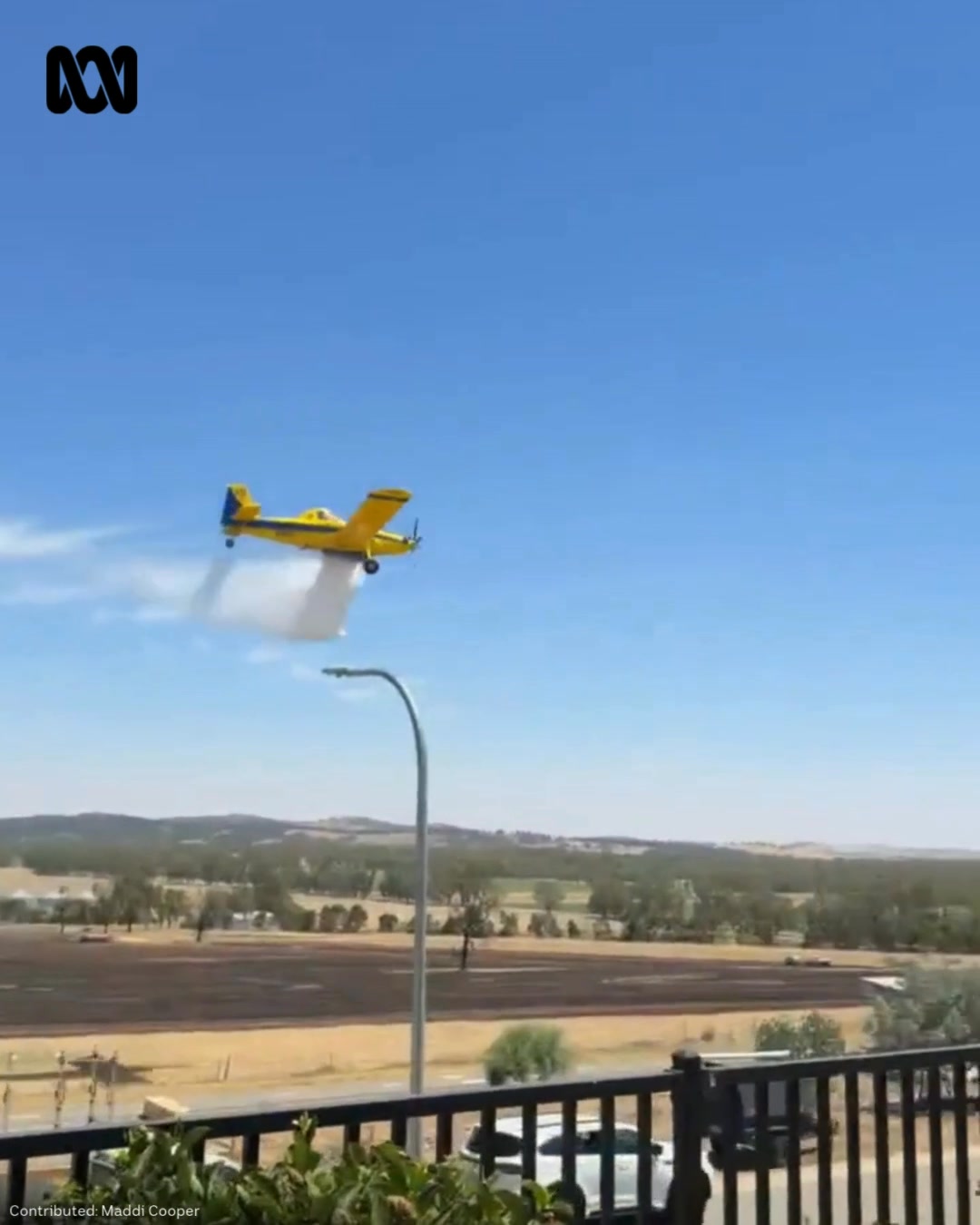 Footage of an air tractor dropping water on a grassfire out at ...