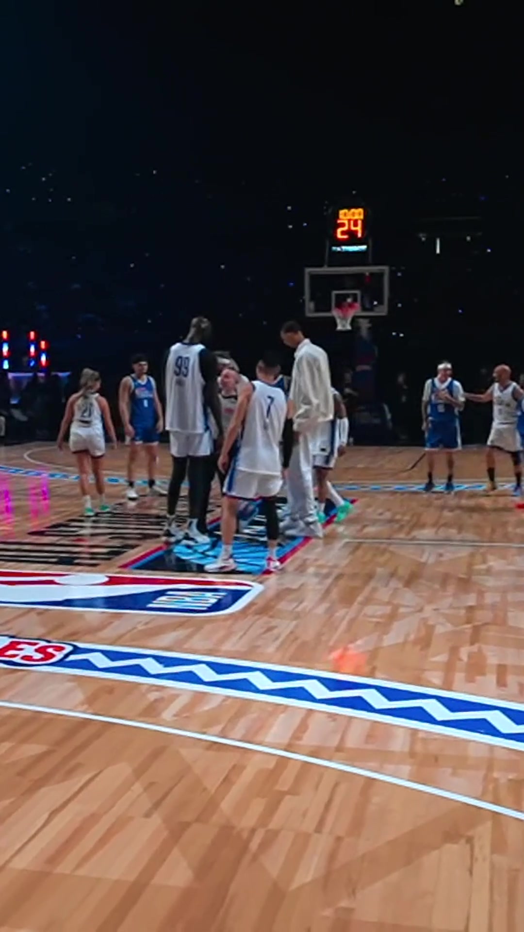 Victor Wembanyama lining up for the opening tip next to Tacko Fall… and ...
