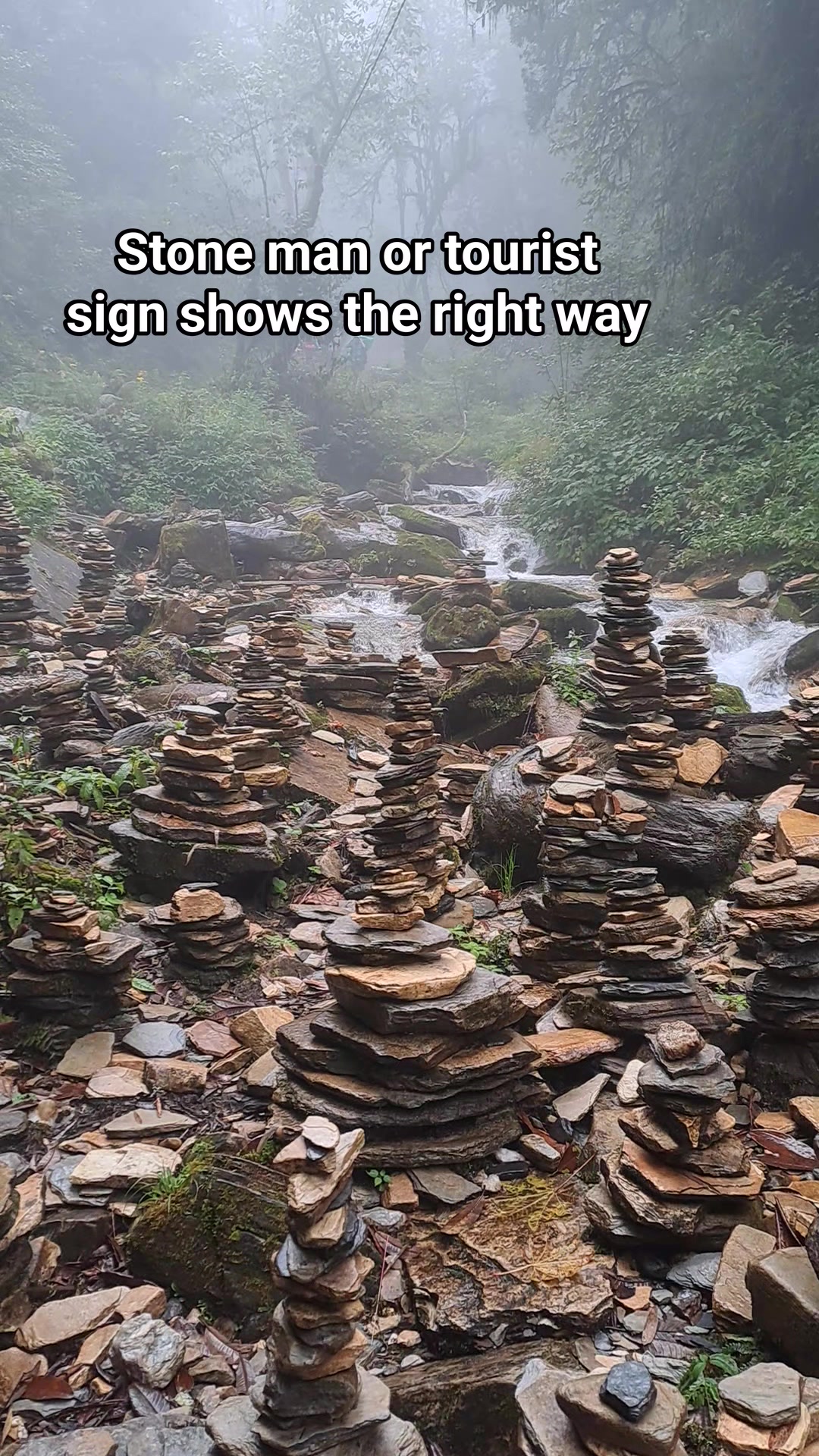 Stone man at Stok Kangri. Stone man or tourist sign shows the right way ...