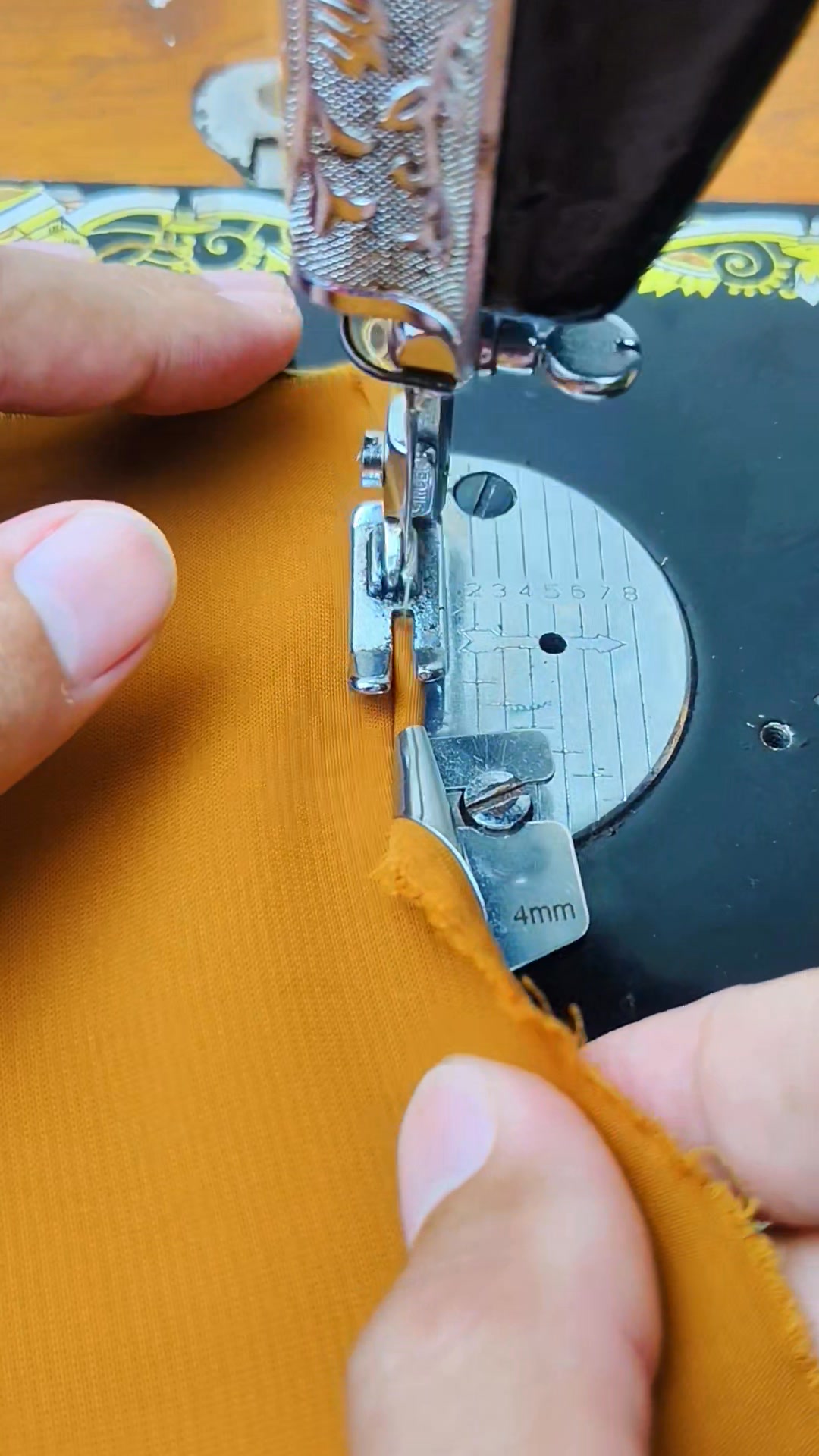 Sewing the edge of the fabric using the sewing machine's hem funnel # ...