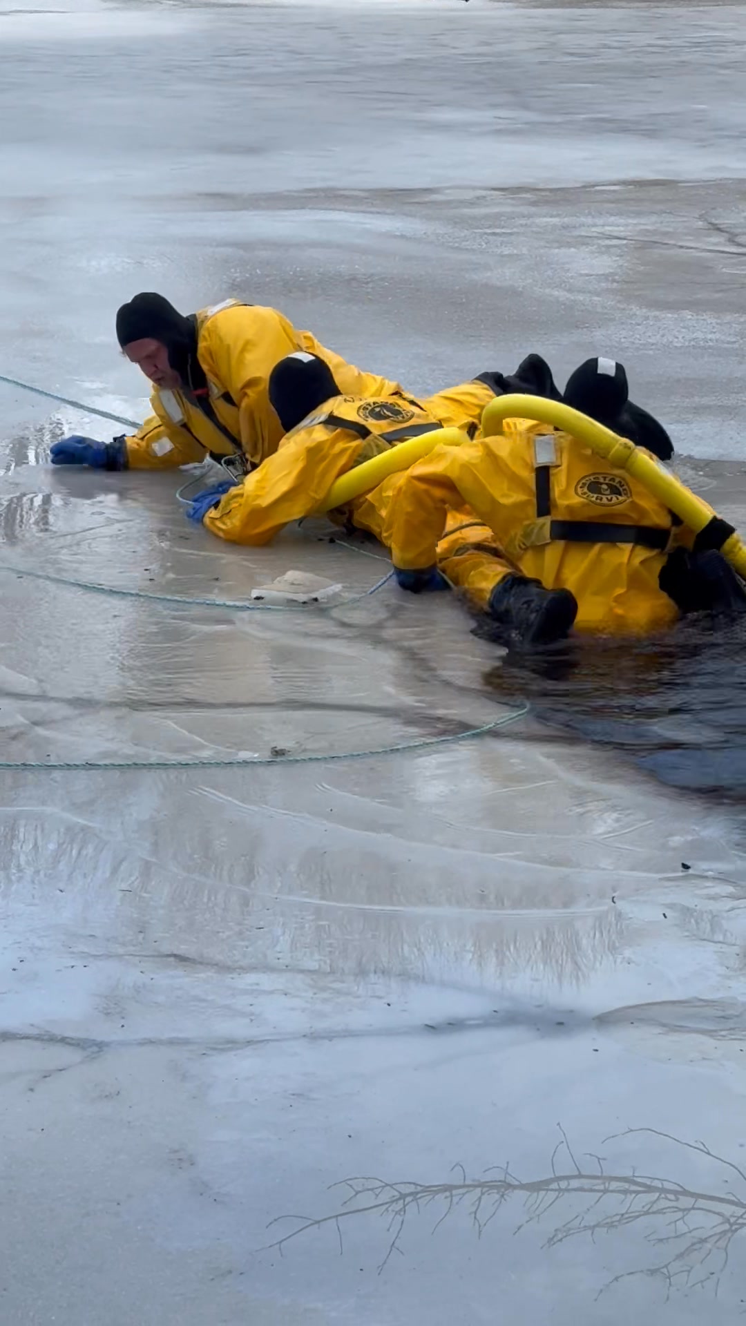 A video of two rescuers and a victim. Note the three safety tether ...