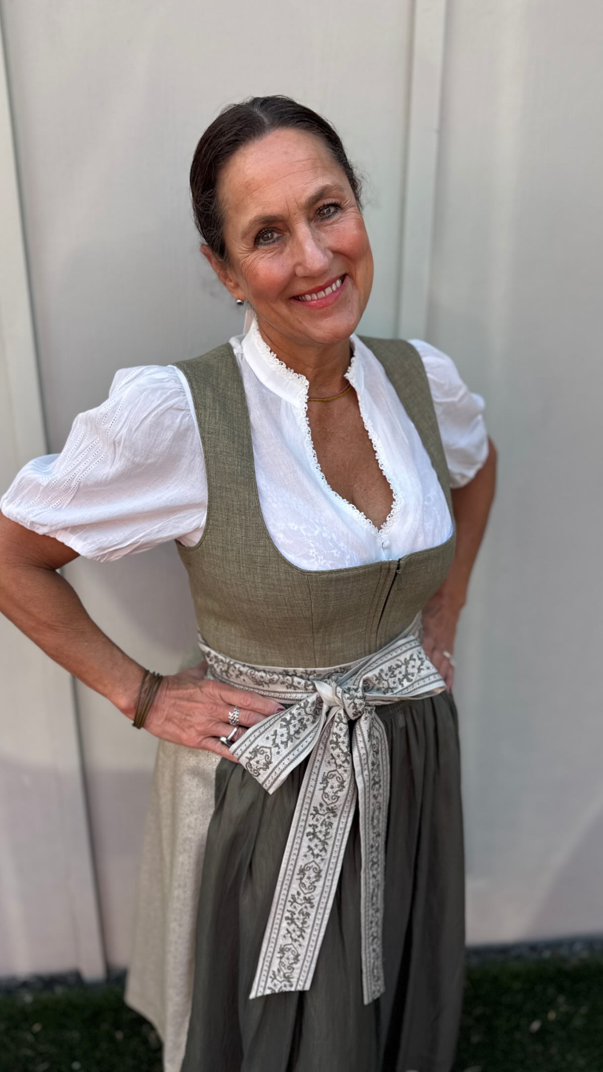 That bow though! The gorgeous pattern is our absolute favorite detail on this beautiful green dirndl! , Come see it (and all of our unique dirndls) in person at Lucky Bucks German Market! , #Dirndl 