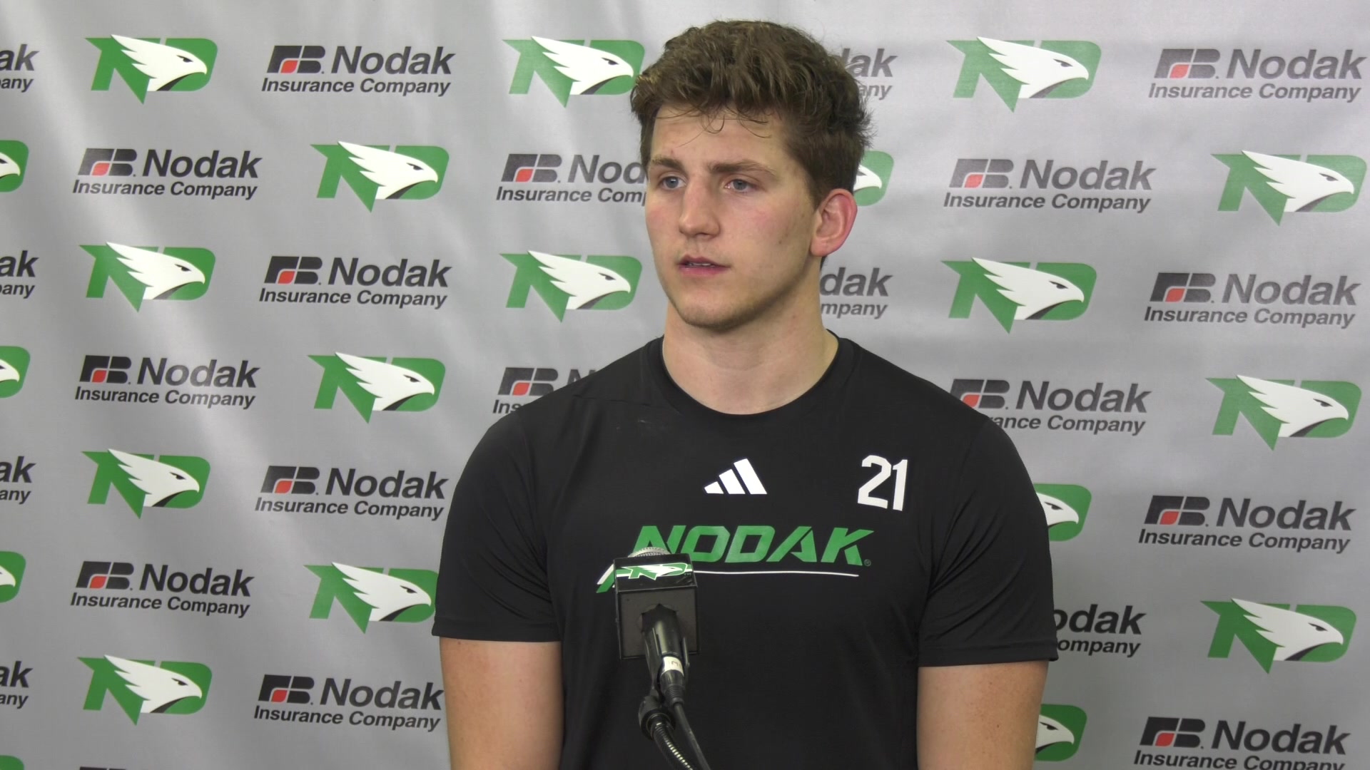 North Dakota Men's Hockey HC Dane Jackson and forward Ben Strinden ...