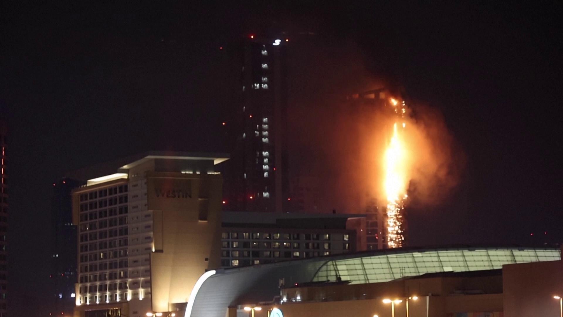 FIRE ERUPTS IN MANAMA AFTER IRANIAN MISSILE ATTACKS A fire hit part of ...