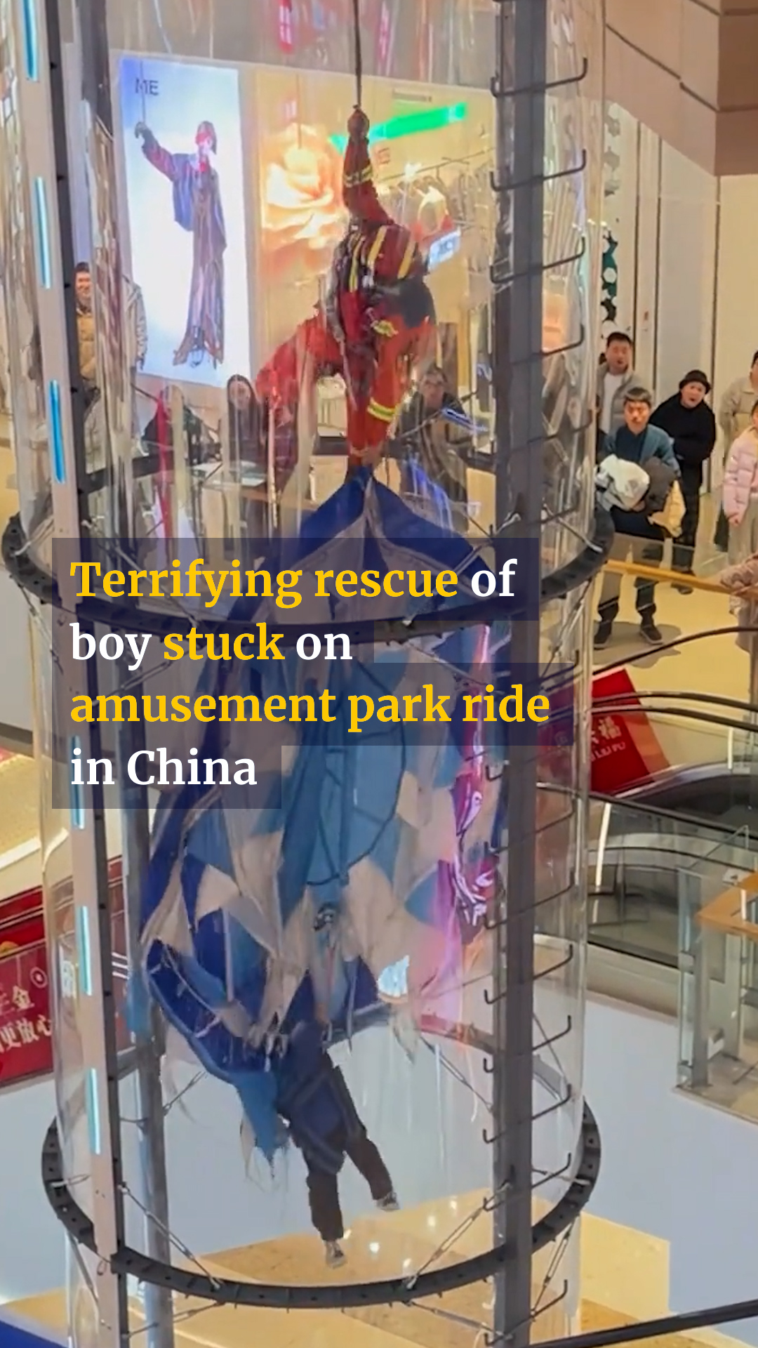 A boy in China had to be rescued mid-air after he became stranded on an ...