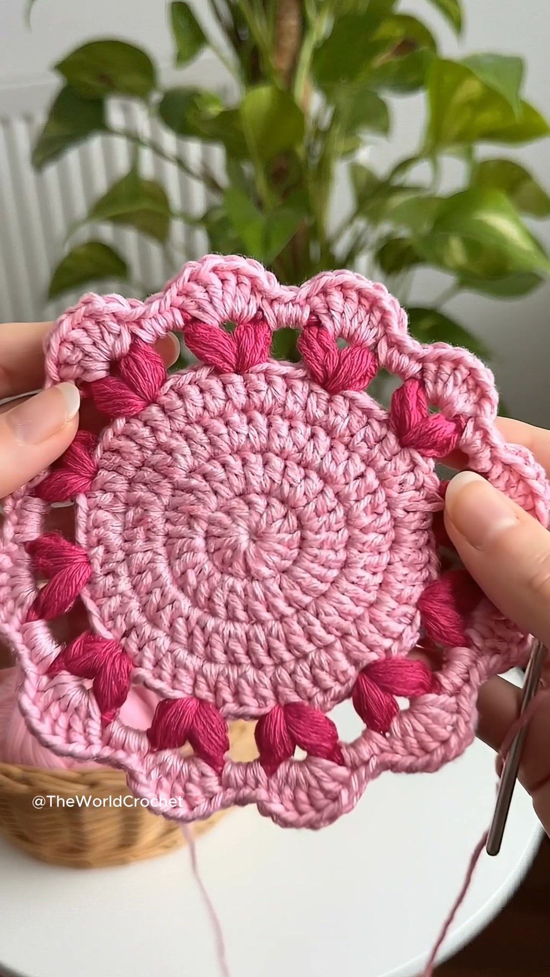 Crocheting this delicate pink mandala stitch by stitch, surrounded by ...