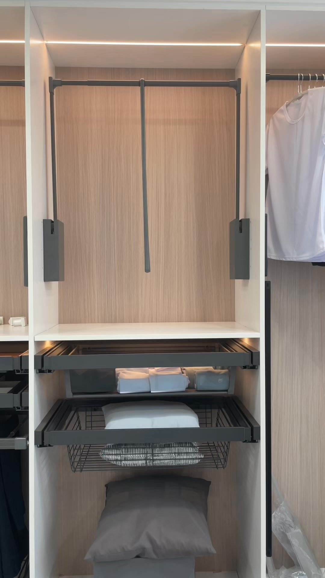 Pull-down closet rods are designed to turn hard-to-reach upper space ...