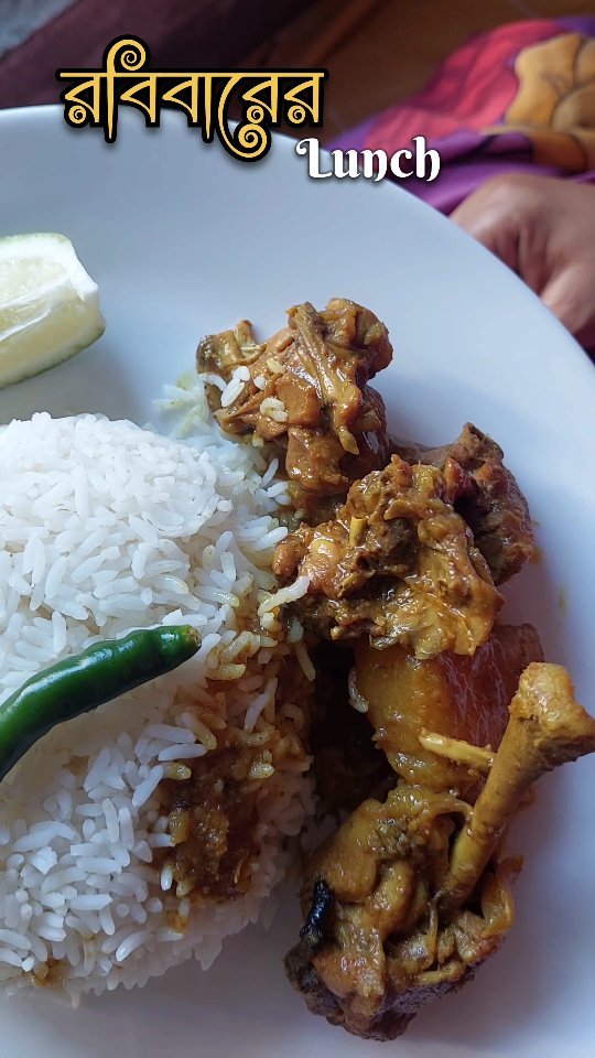 Traditional Bengali thali with chicken kosha and rosogolla